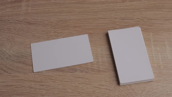Blank White Paper Business Cards on Table