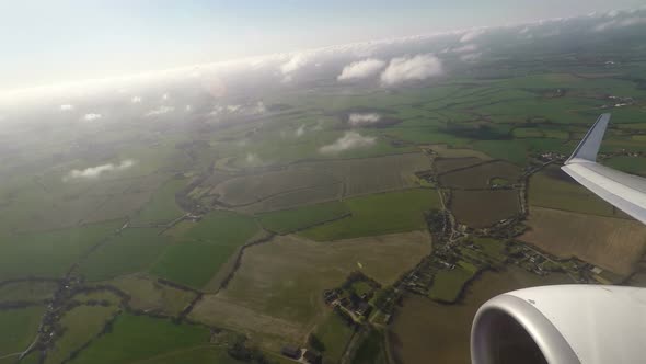 Aerial view of countryside and cloudscape from window seat