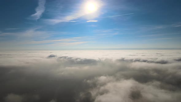 Aerial View From High Altitude of Earth Covered with Puffy Rainy Clouds Forming Before Rainstorm