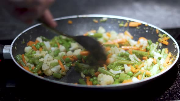 Cooking vegetables on a pan