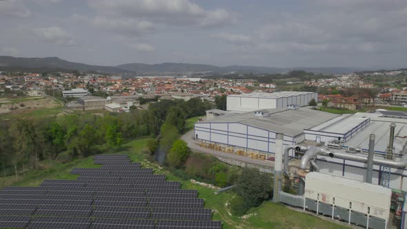 Blue solar panels on factory background