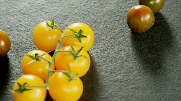 Various tomatoes arranged on grey background 4K 4k