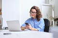 Young business woman using smartphone working in office sitting at desk. - PhotoDune Item for Sale