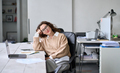 Young happy relaxed professional business woman sitting at work desk, portrait. - PhotoDune Item for Sale