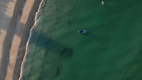 Boats in turquoise green sea