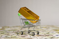 Gold bar in small shopping trolley cart. Online trading or buy gold bars for investment. - PhotoDune Item for Sale
