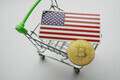 Shopping cart with golden bitcoin btc and flag of the United States of America USA on the table. - PhotoDune Item for Sale