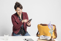 business woman using phone and tablet sitting on a desk at home workplace, - PhotoDune Item for Sale