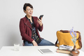 business woman using phone and tablet sitting on a desk at home workplace, - PhotoDune Item for Sale