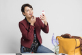 Pretty happy businesswoman doing make up in office - PhotoDune Item for Sale