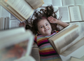 Child surrounded by books - PhotoDune Item for Sale