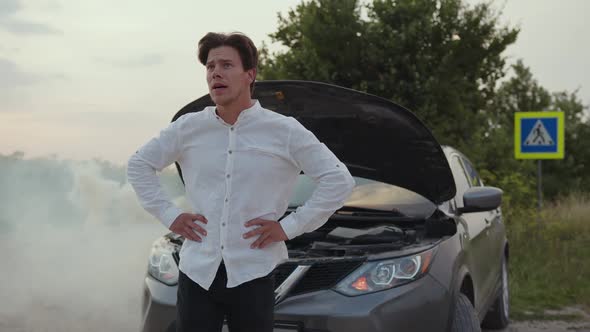 Man Waits for the Car Service of the Road