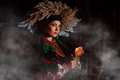Ukrainian woman with candle, she in traditional costume outdoors at night. Pray - PhotoDune Item for Sale