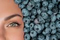 Half woman face in fresh ripe berries - blueberries, organic bilberry plant - PhotoDune Item for Sale