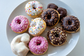 Assorted ring doughnuts covered in icing and sprinkes - PhotoDune Item for Sale