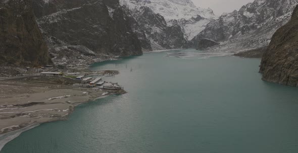 Aerial Over Attabad Lake, Revealing Mountain View, Hunza Valley. Dolly Back