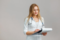 Young European Doctor Examines the Anamnesis, Medical Record of the Patient. - PhotoDune Item for Sale