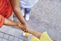 Multiethnic children puting on hands together - PhotoDune Item for Sale