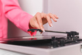 Female hand in pink blazer starting vinyl turntable at the home party - PhotoDune Item for Sale