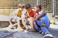 Happy multiethnic kids playing with a mobile phone - PhotoDune Item for Sale
