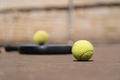 Padel balls and racket on court - PhotoDune Item for Sale
