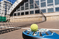 Padel ball under racket on court - PhotoDune Item for Sale