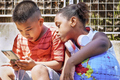 mobile phone handled by interested multiethnic children - PhotoDune Item for Sale