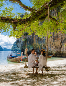 ding Krabi Thailand part of the Koh Hong Islands in Thailand. beautiful beach with limestone cliffs and longtail boats