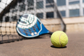Padel racket and ball on court - PhotoDune Item for Sale