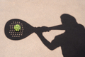 Shadow of padel racket over ball - PhotoDune Item for Sale