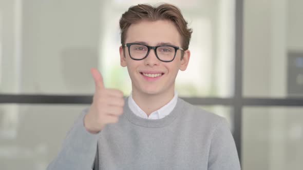 Portrait of Young Man Showing Thumbs Up Sign
