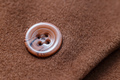 Buttons on wool coat. Clothes repair. Close-up button - PhotoDune Item for Sale