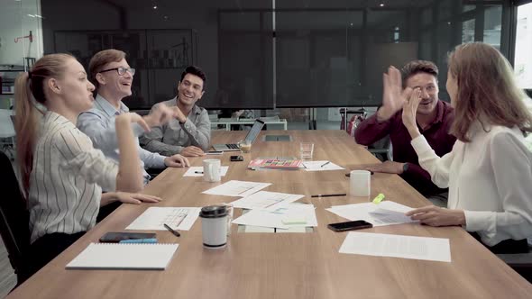 Successful Business Team Giving Each Other A High Five