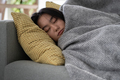 Calm Asian young woman peacefully lying relaxing resting on cozy couch sleeping taking nap at home. - PhotoDune Item for Sale