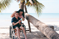 Outdoor activity travel by wheelchair with diverse family. - PhotoDune Item for Sale