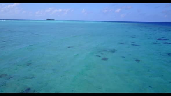 Aerial top down tourism of tropical island beach break by aqua blue water and bright sandy backgroun