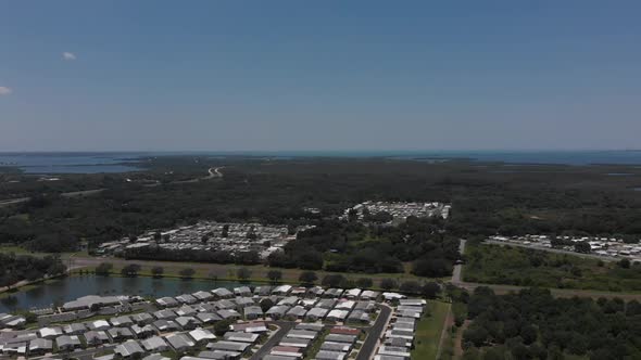 Largely undeveloped coastal mangroves in South Florida, USA.  Groups of trailer parks with retirees