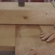 Old hands pushing wood through a filler - VideoHive Item for Sale