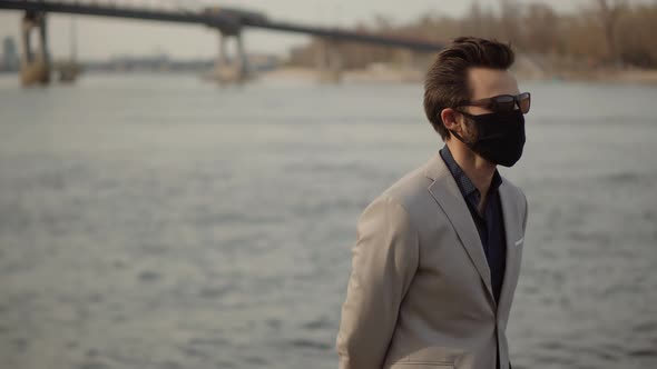 Businessman In Face Mask On Quarantine Prevention Contagion Epidemic Coronavirus.Man Walking In Mask