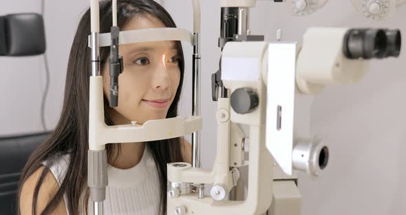 young woman having eye test