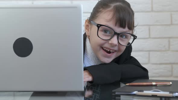 Hiding head by computer. 