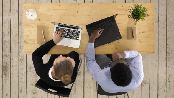 Business Team Working Using Laptops