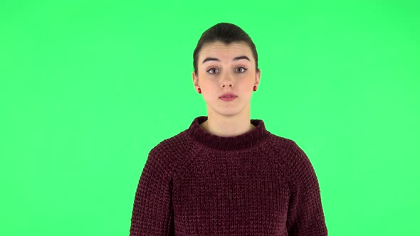 Girl Talks About Something Then Making a Hush Gesture, Secret. Green Screen