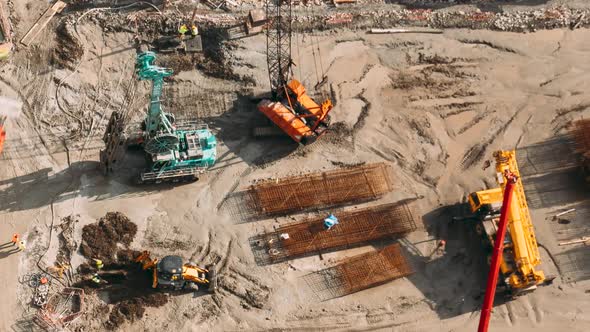 Construction Cranes and Excavators Machinery Working in Development on Construction Site alt