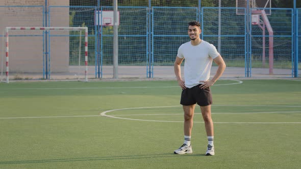 Attractive Athlete Indian Guy in Summer Sportswear Resting Between Workout Exercises Breathing Fresh