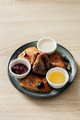 Delicious thin pancakes with jam, honey and sour cream on light wooden table. Copy space - PhotoDune Item for Sale