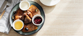 Delicious thin pancakes with jam, honey and sour cream and cup of tea on light wooden table.  - PhotoDune Item for Sale
