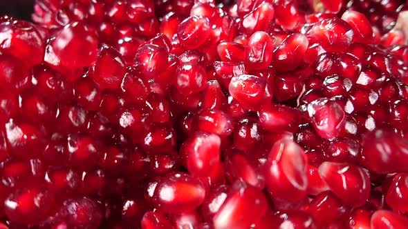 Handful of Pomegranate Grains Is Falling Down