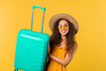 Young pretty woman with carry-on suitcase yellow background. Teenager traveling - PhotoDune Item for Sale