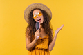 Woman singing, dancing with hair brush instead microphone on yellow background. - PhotoDune Item for Sale
